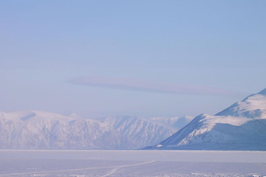 A snow covered mountain in the distance with a sky background