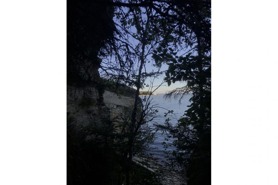 The MV Namao barely visible in the distance, as seen from the pine dock limestone caves.