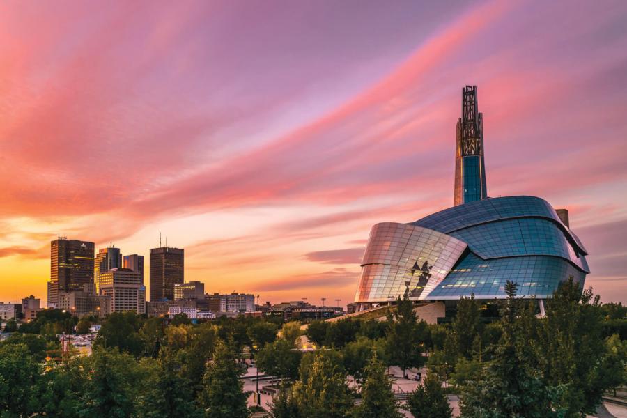 A sunset view of Winnipeg overlooking downtown and the Human Rights Museum.