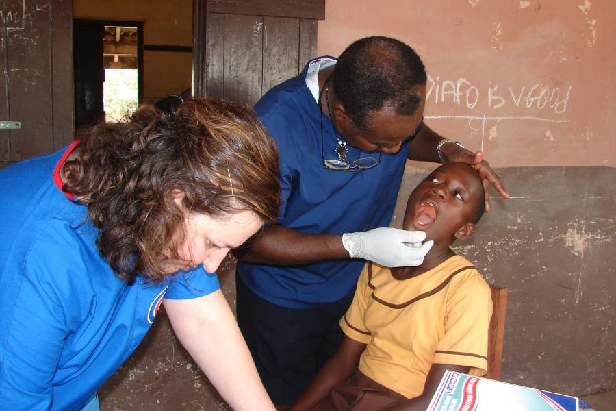 Dentist examining a child.