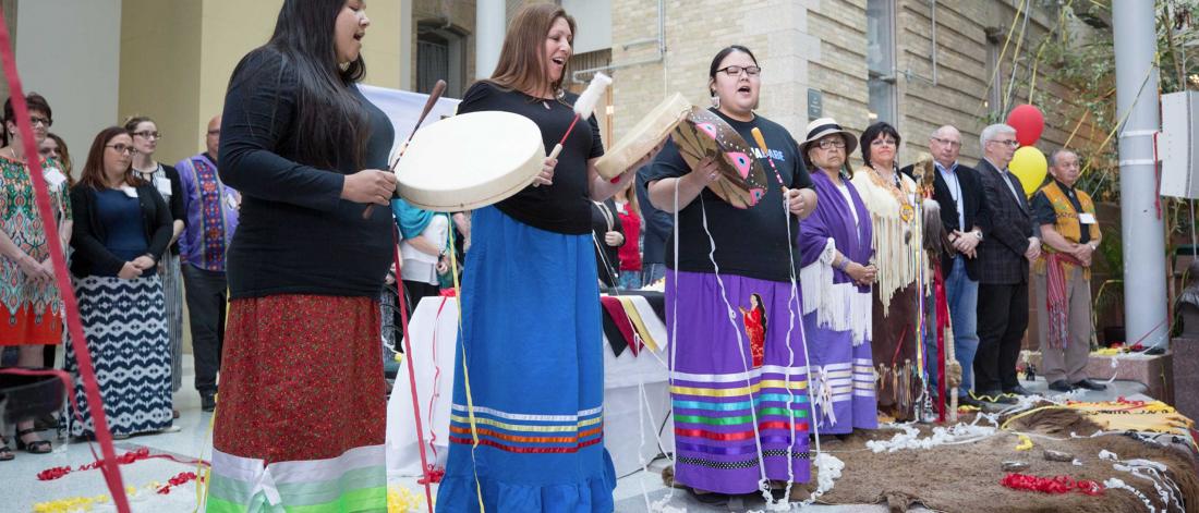 Indigenous women perform at the launch of the Indigenous Institute of Health and Healing.