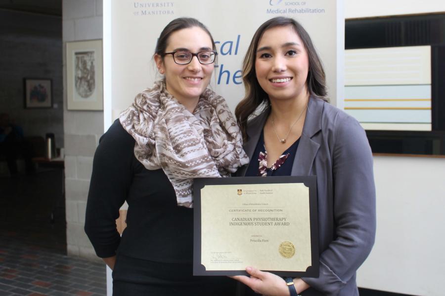 Student receives award parchment