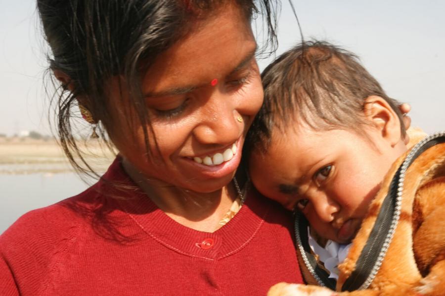 A woman holding a child.