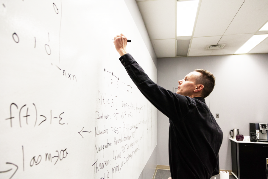 Steve Kirkland doing a mathematical equation on the whiteboard