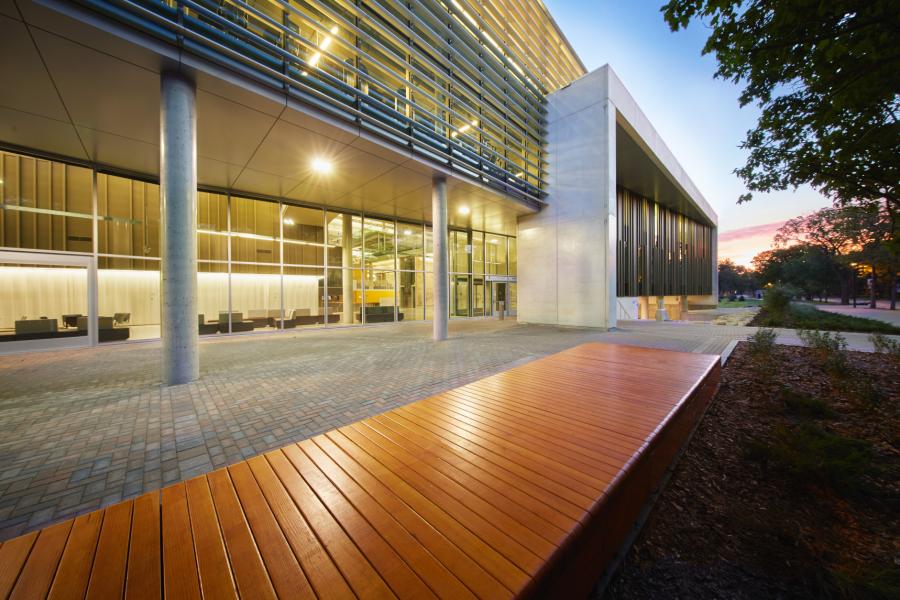 A beautifully illuminated front entrance of the Active Living Centre during a sunset.