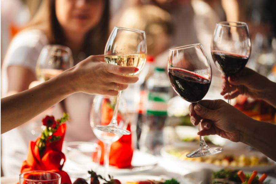 People around a table enjoy wine