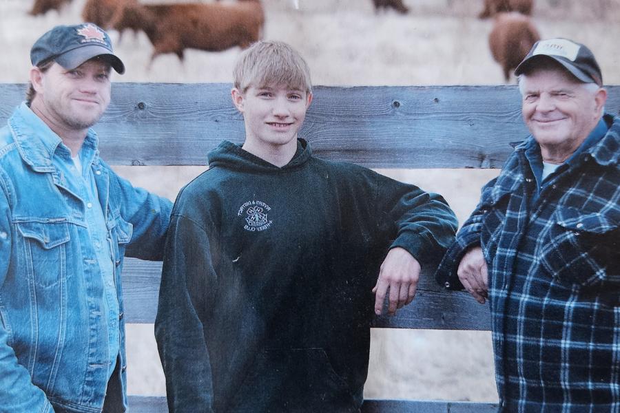 Clayton, Quinn and Brian Robbins in the pasture
