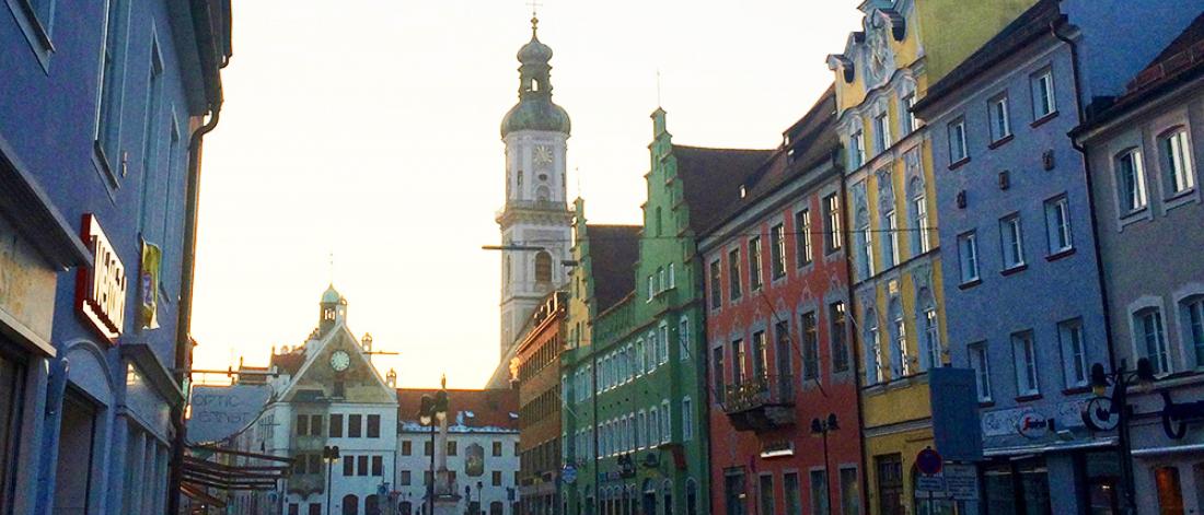 a street with close colourful buildings
