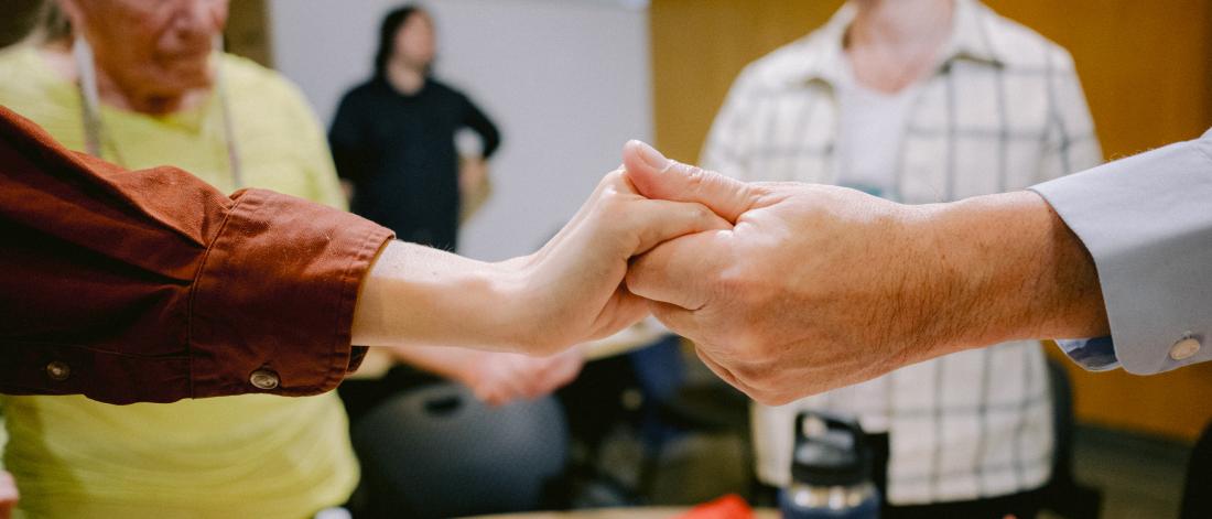 circle of people holding hands