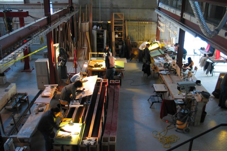 An interior view of the Centre for Architectural Structures and Technology lab with students working on various projects.