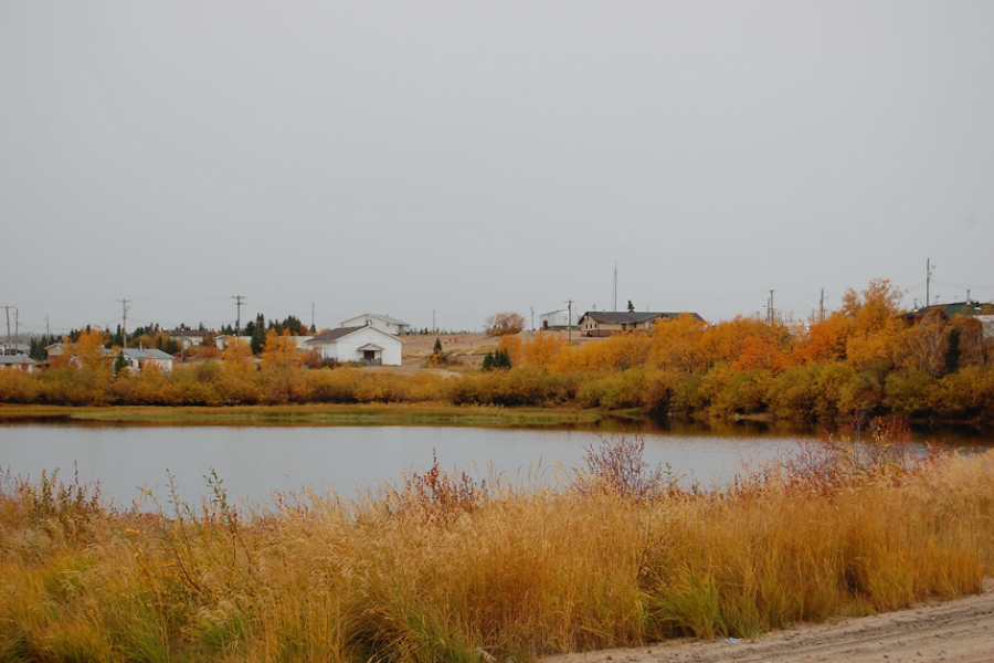 small lake, prairie landscape and houses
