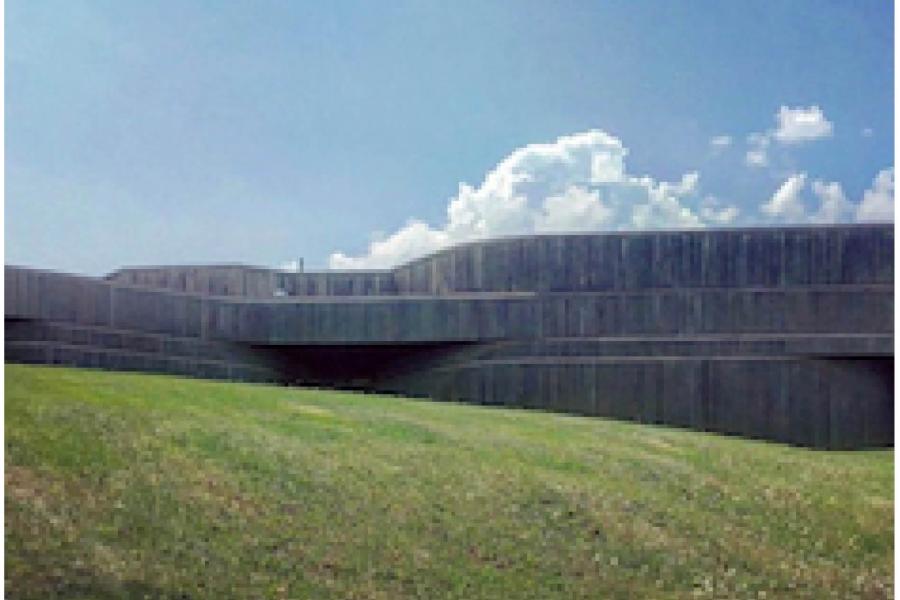 a hill, a building, and the sky