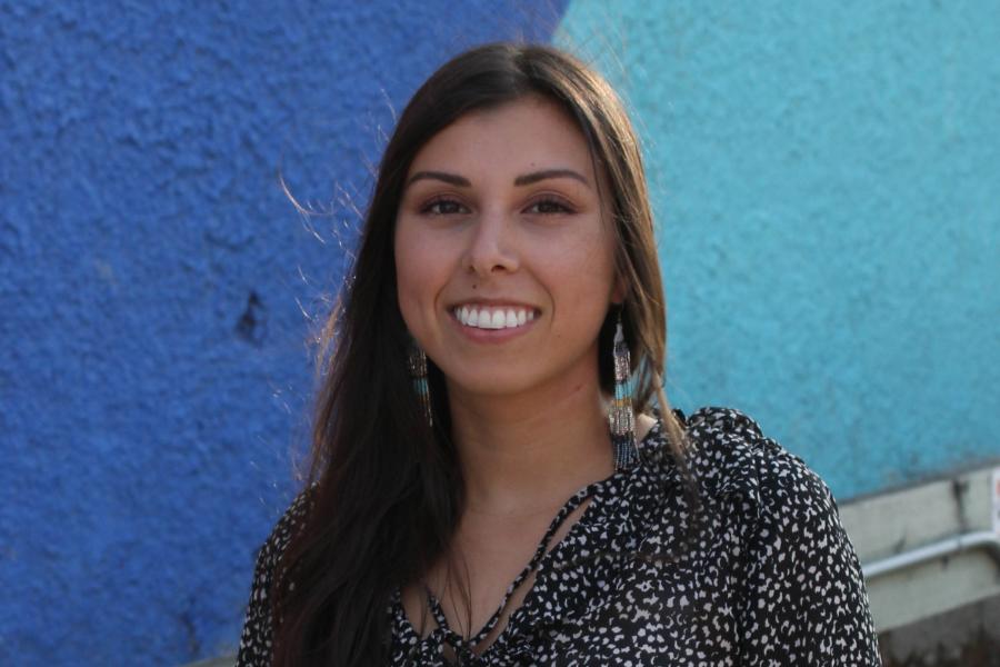 Danielle Desjarlais standing in front of a blue wall