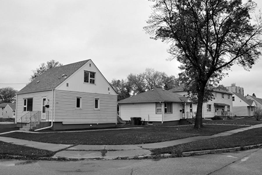 Existing site is a series of small homes on barren streets