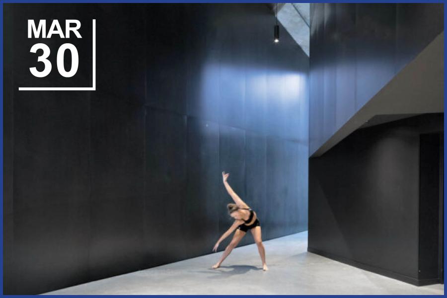 Industrial looking hallway with dancer