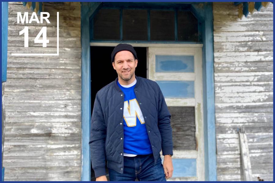 Portrait of Robert Galston outside an abandoned house.