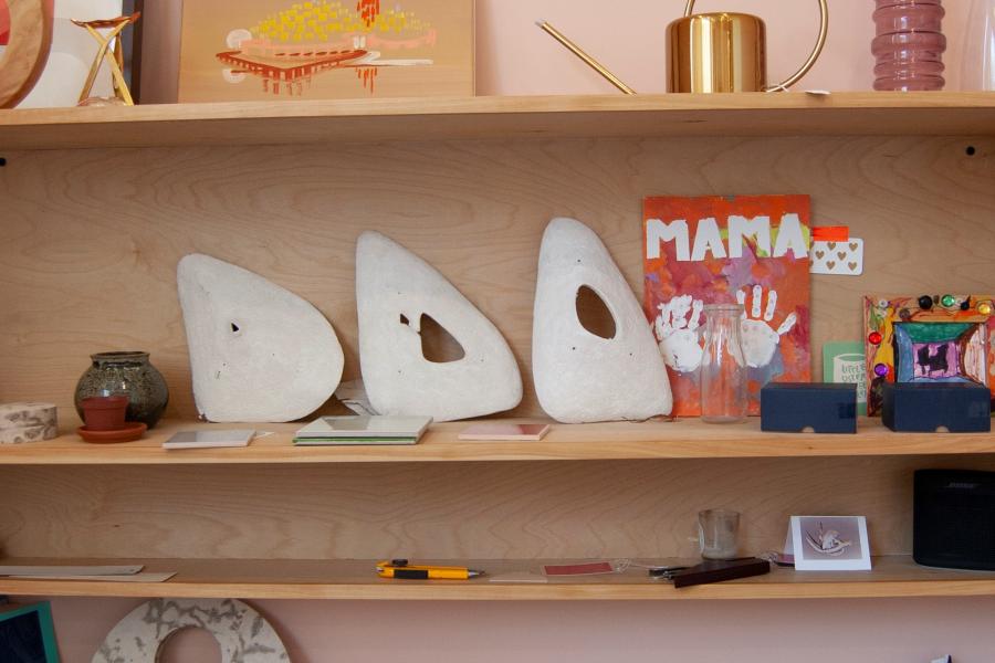 Shelf filled with crafts and small objects