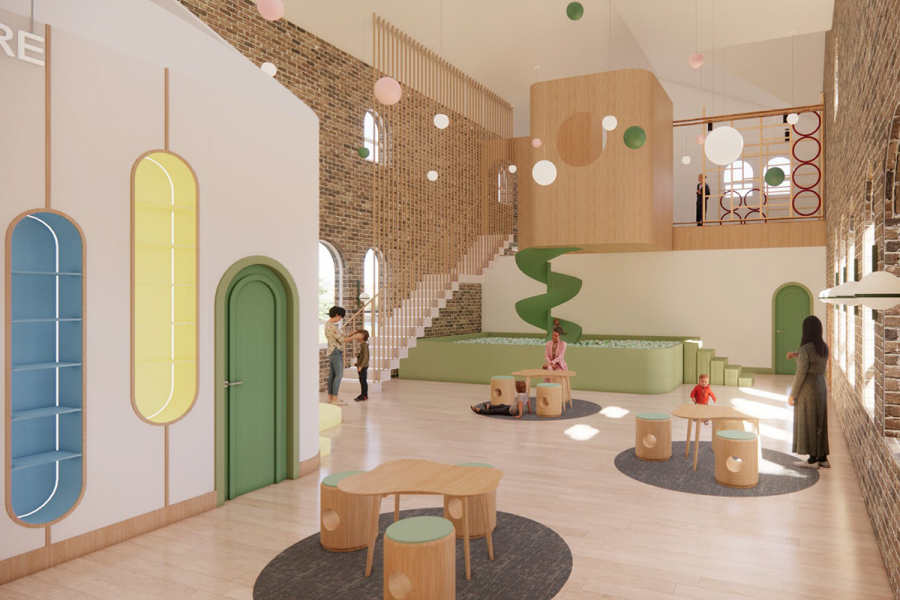 An indoor playground with a green spiral slide.