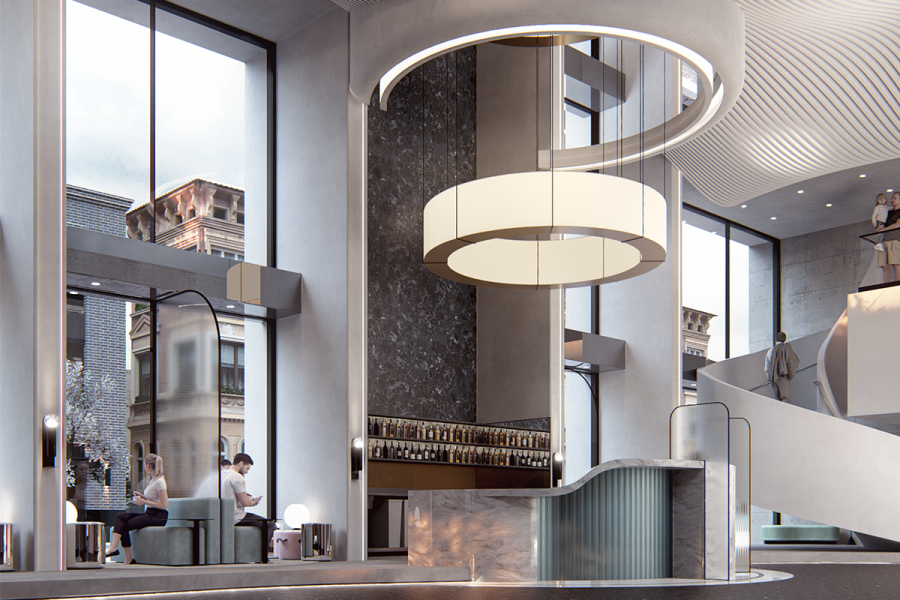 A lobby with a grand white light feature and a wine display.