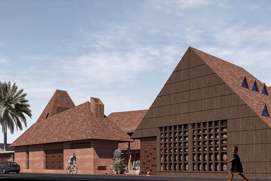 A modern building with large triangular roofs and brick textures under a clear sky. A cyclist and pedestrian pass by. A palm tree is in the background.