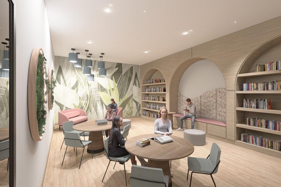 Modern library lounge with people relaxing and reading. Soft seating, round tables, bookshelves, and nature-themed wallpaper create a cozy atmosphere.