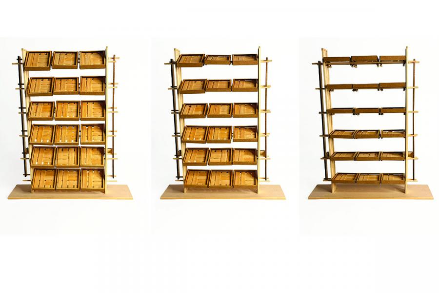 Three wooden shelves display stacked, open lids revealing empty compartments.