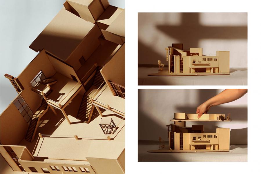 Cardboard architectural model shows a building's interior and exterior.