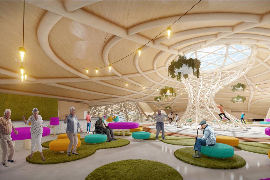 Bright, modern living space with elderly people socializing on colorful seating. Features a large skylight, wooden ceiling, and climbing structure.