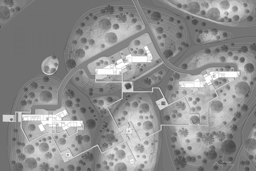 Architectural site plan in grayscale, showcasing multiple buildings and winding paths surrounded by landscaped areas with trees and foliage.