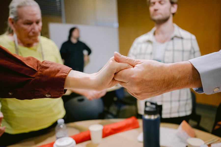 circle of people holding hands