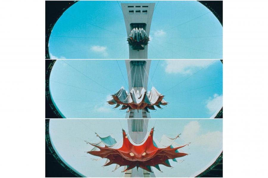 Three-panel view of a futuristic tower sculpture against a bright blue sky, unfolding from a small form into a dramatic red, lotus-like shape.