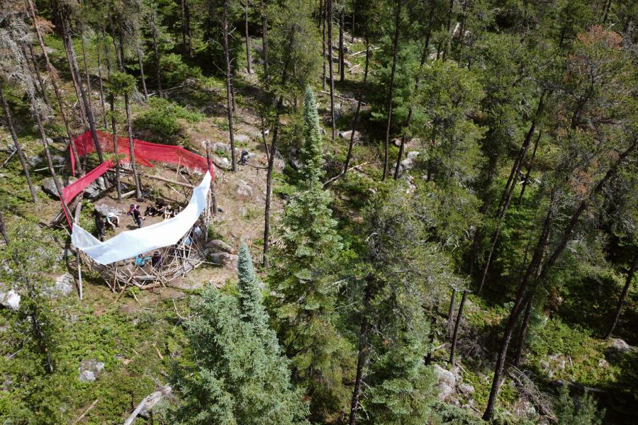 red and white fabric cover a circle  in the forest