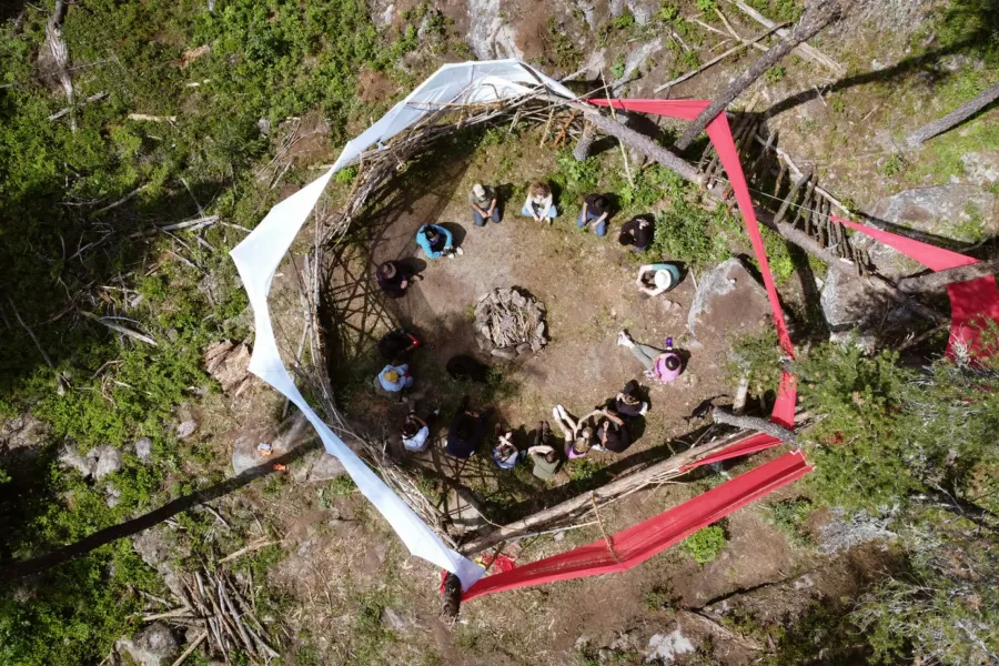 drone shot of people sitting in a circle