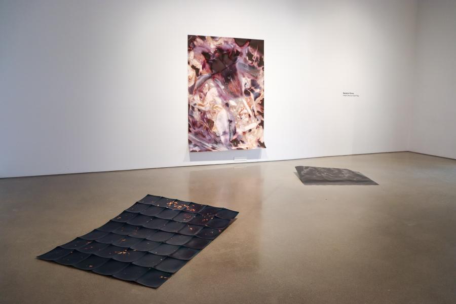 Installation view of "What If the Sun Didn’t Rise" exhibition at the School of Art Gallery, 2024, featuring a vibrant wall piece and floor installations.