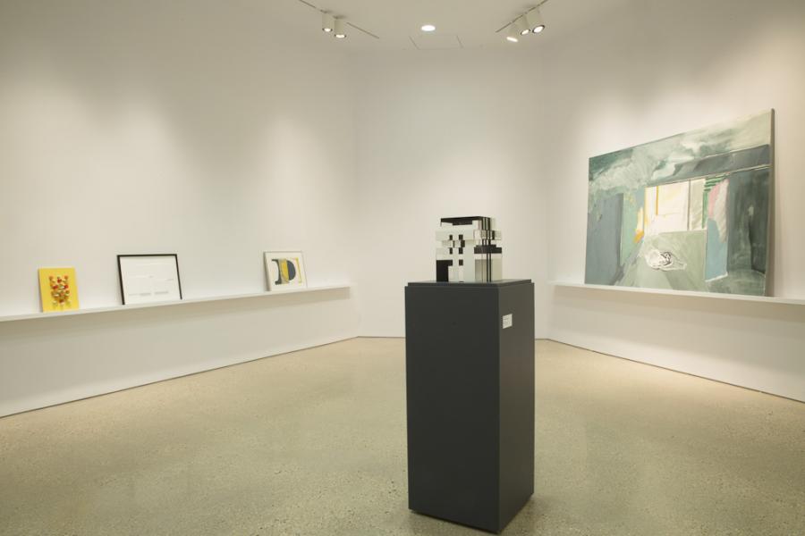 Gallery installation with a modern sculpture on a pedestal and a large-scale abstract painting in soft pastel hues on the wall.