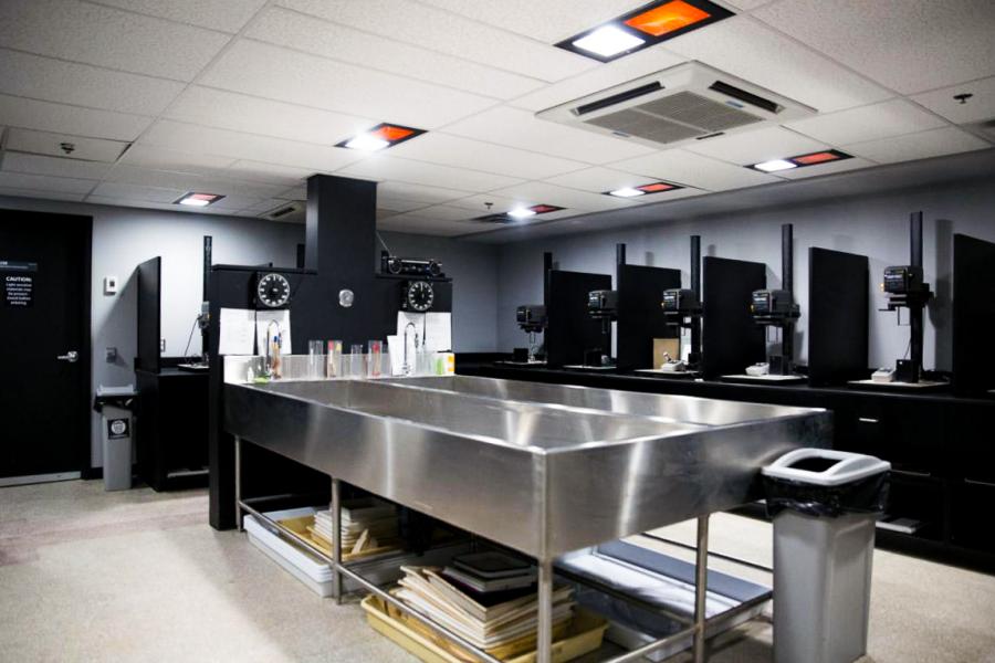 The dark room facilities with various work stations. 