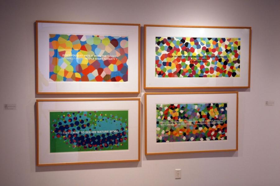 Four artworks on a wall, comprising colourful dotted textures obscuring uppercase captions. Clockwise from the top left, they read “don’t you just hate it when the ‘I don’t normally party’ people start to party?” in white text, “top secret two step program to ensure happiness 1. Collect vices 2. Maintain vices” in black text, “well, I guess there is nothing left to do but put away the bottles, sweep up the eyeballs and lock the front door” in white text, and “I can’t wait to see his mature work.”