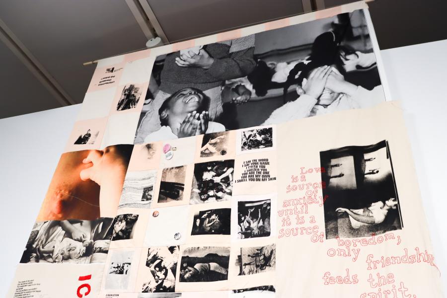 Textile collage installation combining photographs, text, and archival imagery.