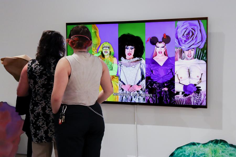 Visitors viewing a video installation in Séamus Gallagher's It's A Mess exhibition.