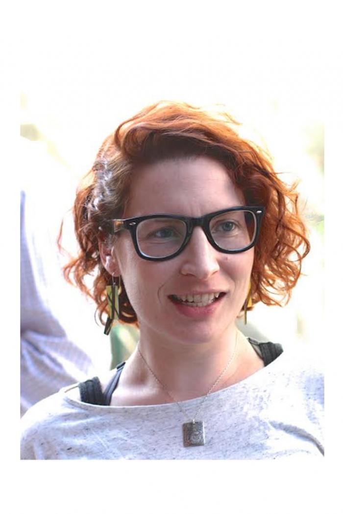 Headshot of Sarah Hannan standing outside.