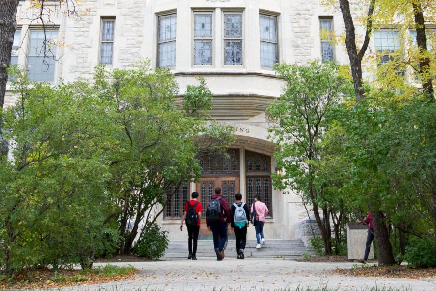 Students entering the front of the Tache arts building.