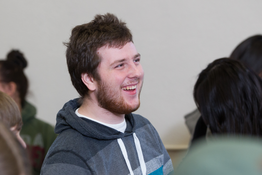 A student laughs during a lecture.