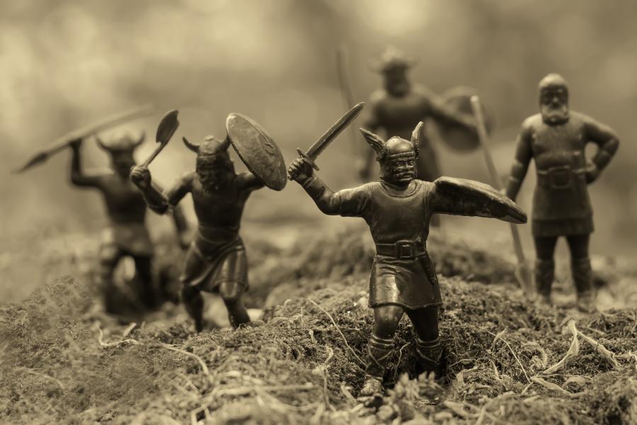A collection of small game pieces shaped like vikings.