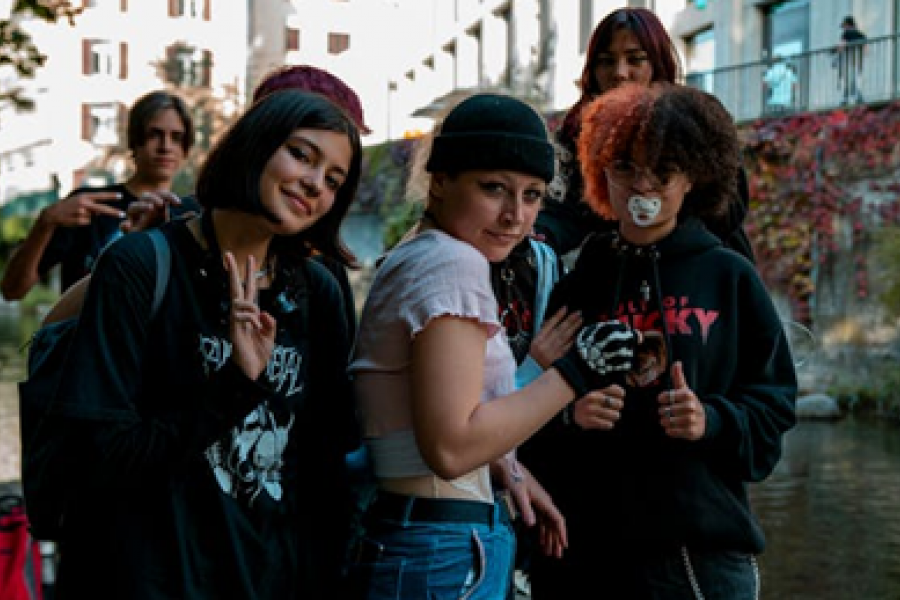 A group of older teenagers hamming it up for the camera. 