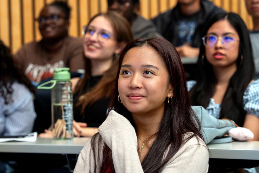 A student smiling during a presentation 