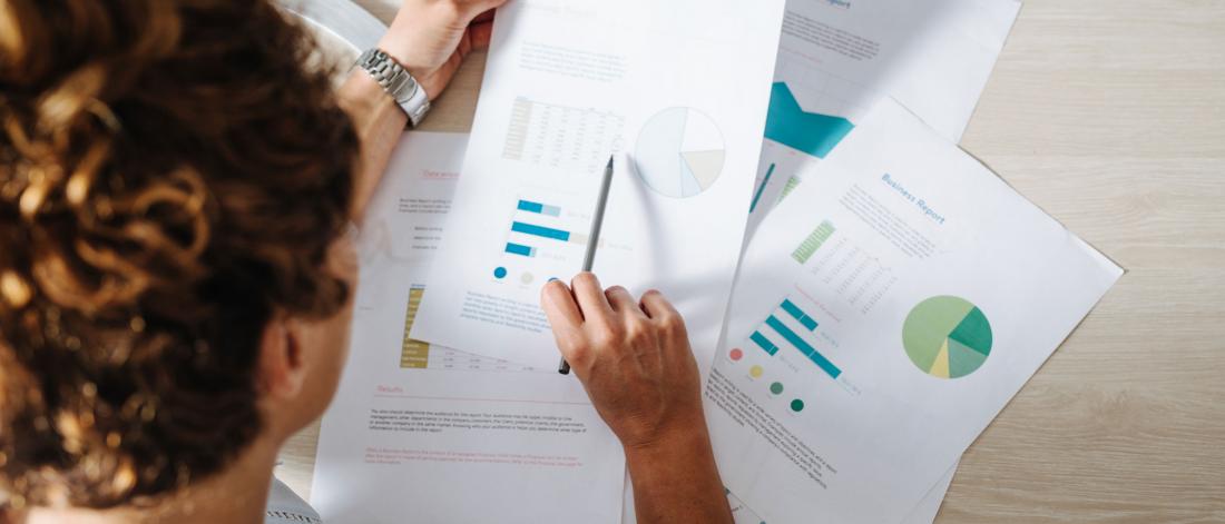 Business professional analyzing financial reports.