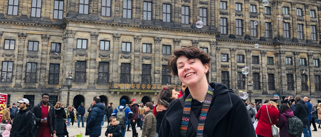 photo of a female student posing in front of a building in Netherland