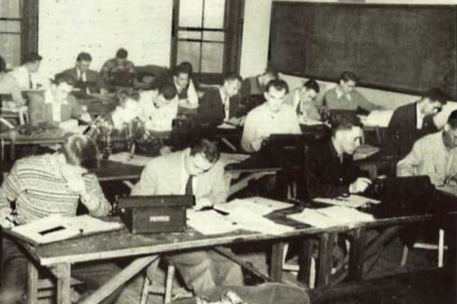 Black and white photo of all male commerce class.