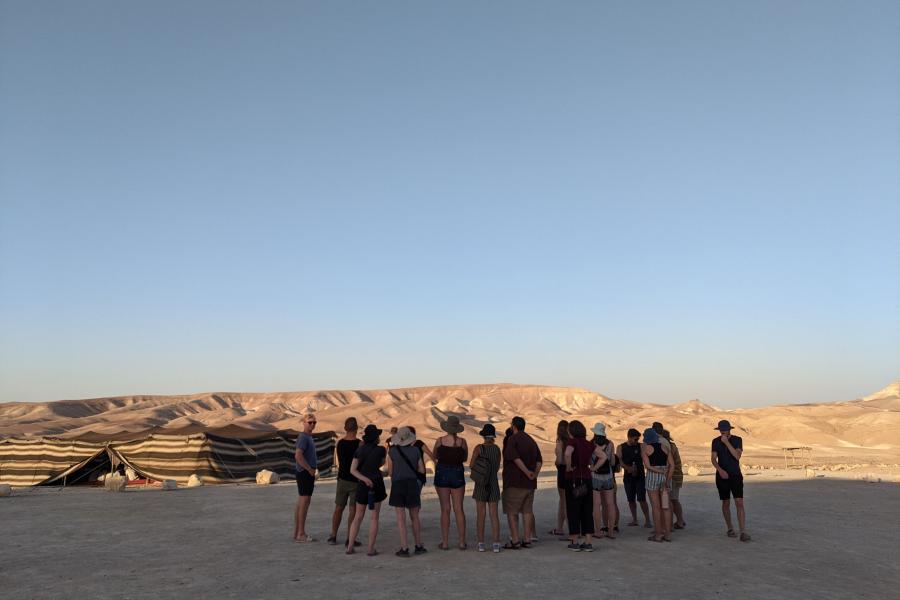 Students at sunset at a Bedouin camp
