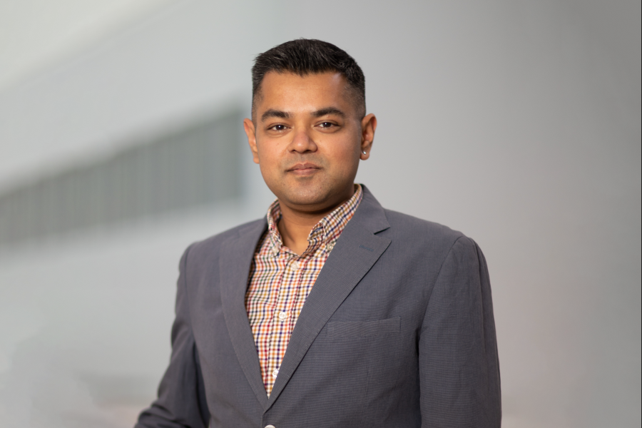 Rohan Shanker wearing grey suit jacket.